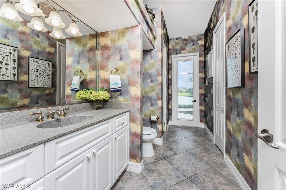 3290 Sugarloaf Key Road Punta Gorda, FL 33955 - Photo 29 of 50 a spacious bathroom with a shower sink and mirror