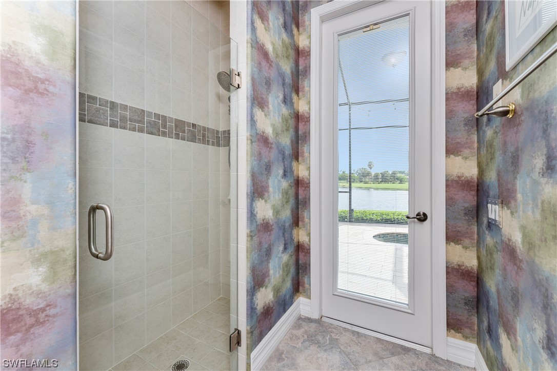 3290 Sugarloaf Key Road Punta Gorda, FL 33955 - Photo 30 of 50 a bathroom with a glass shower door