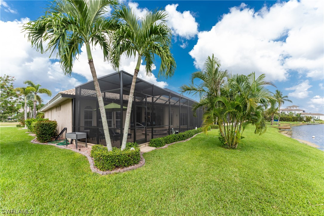3290 Sugarloaf Key Road Punta Gorda, FL 33955 - Photo 44 of 50 a view of a house with a yard and a tree