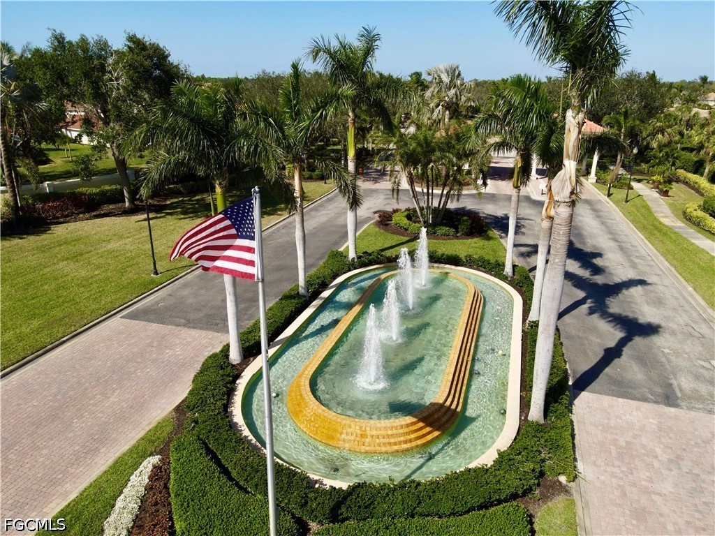 19694 Villa Rosa Loop Estero, FL 33967 - Photo 24 of 28 swimming pool view with a garden and outdoor seating