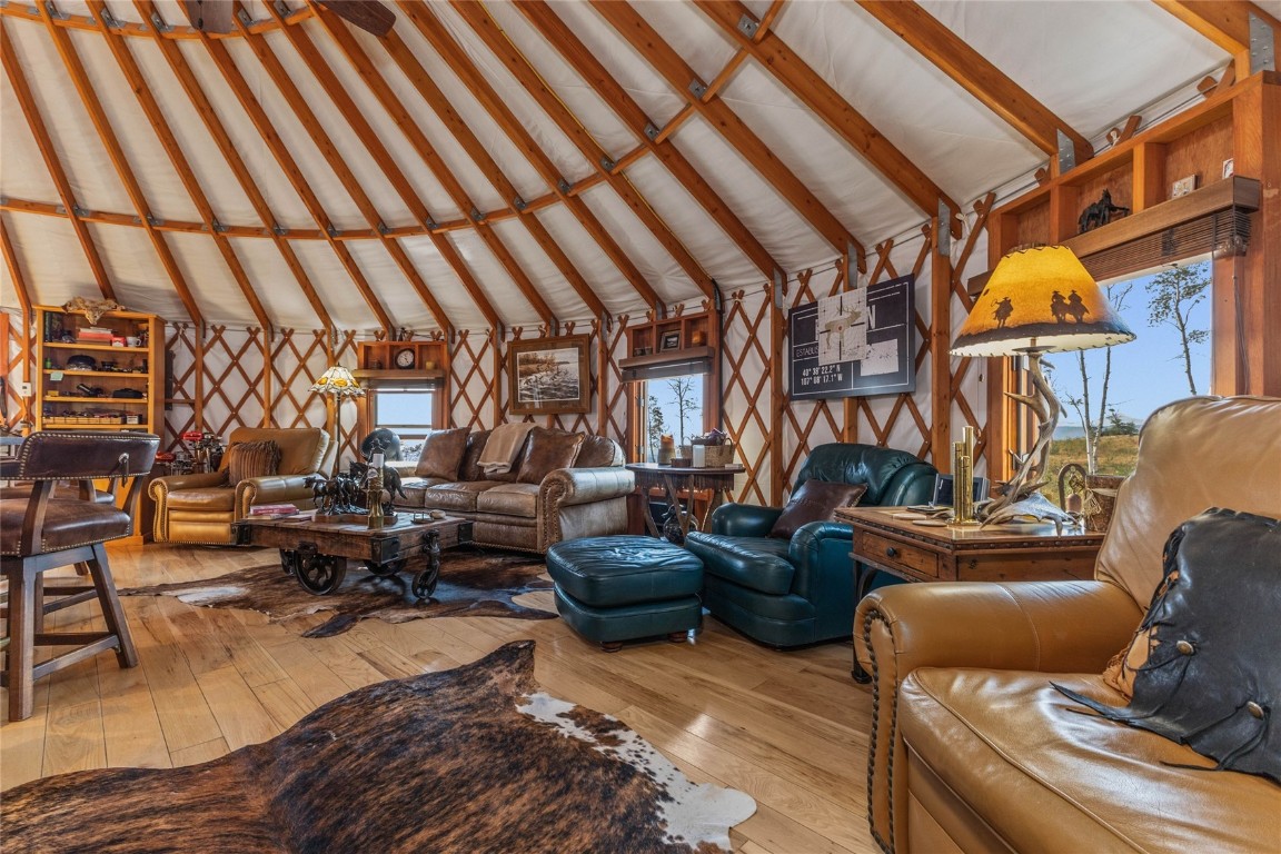 50166 County Road 80 Hayden, CO 81639 - Photo 20 of 50 a living room with furniture a rug and a chandelier