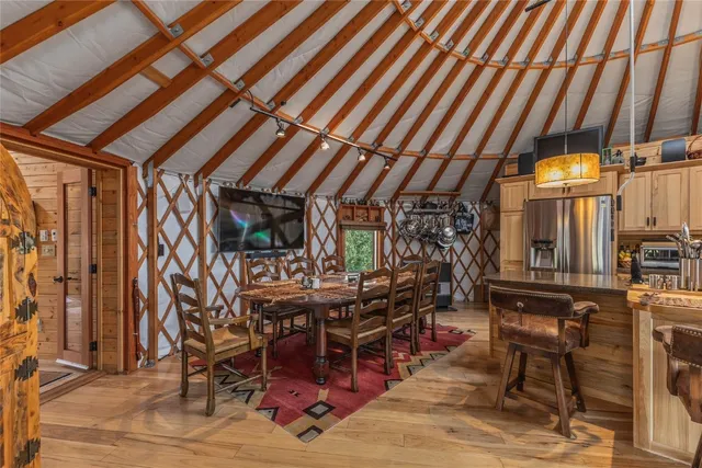 a view of a dining room with furniture window and outside view