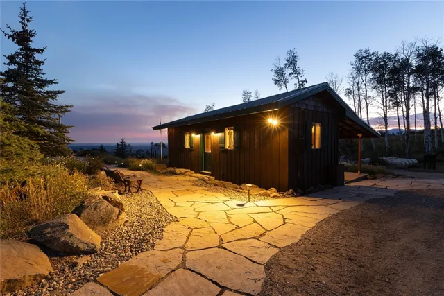 a view of a yard with furniture and outdoor seating