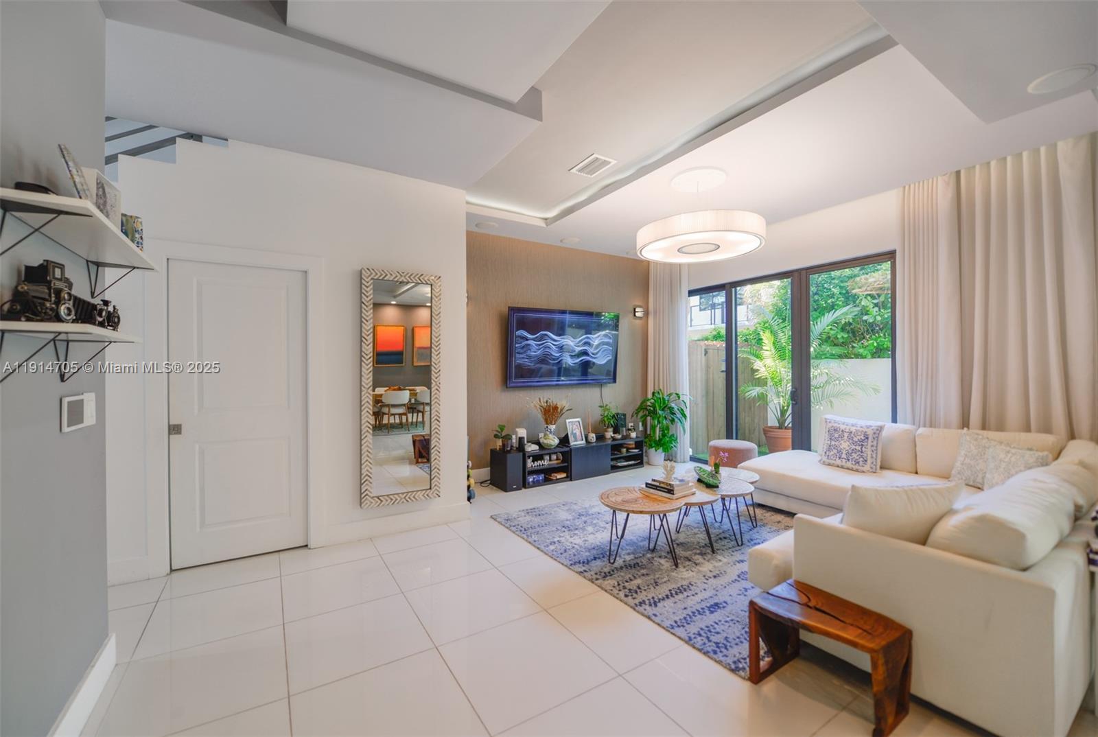 3318 Day Avenue, Unit 7 Miami, FL 33133 - Photo 11 of 39 a living room with furniture and a large window