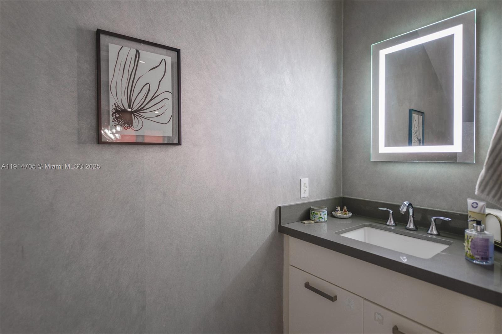 3318 Day Avenue, Unit 7 Miami, FL 33133 - Photo 16 of 39 a bathroom with a sink and a mirror