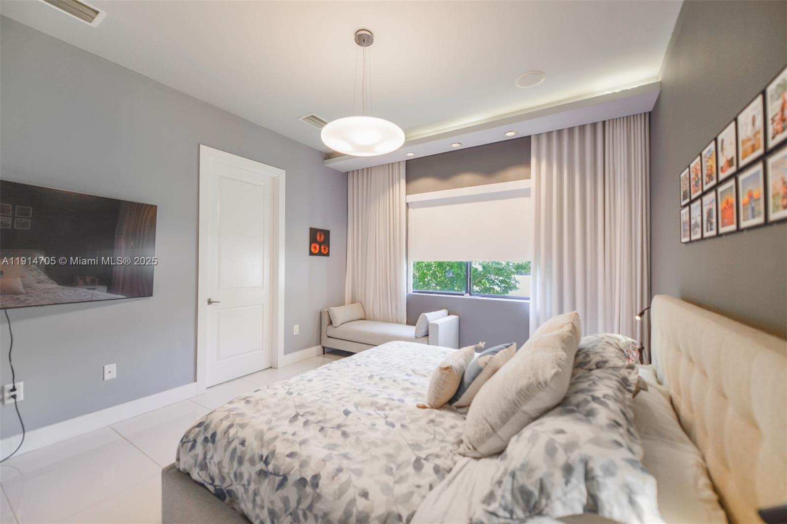 3318 Day Avenue, Unit 7 Miami, FL 33133 - Photo 20 of 39 a bedroom with a large bed and a large window