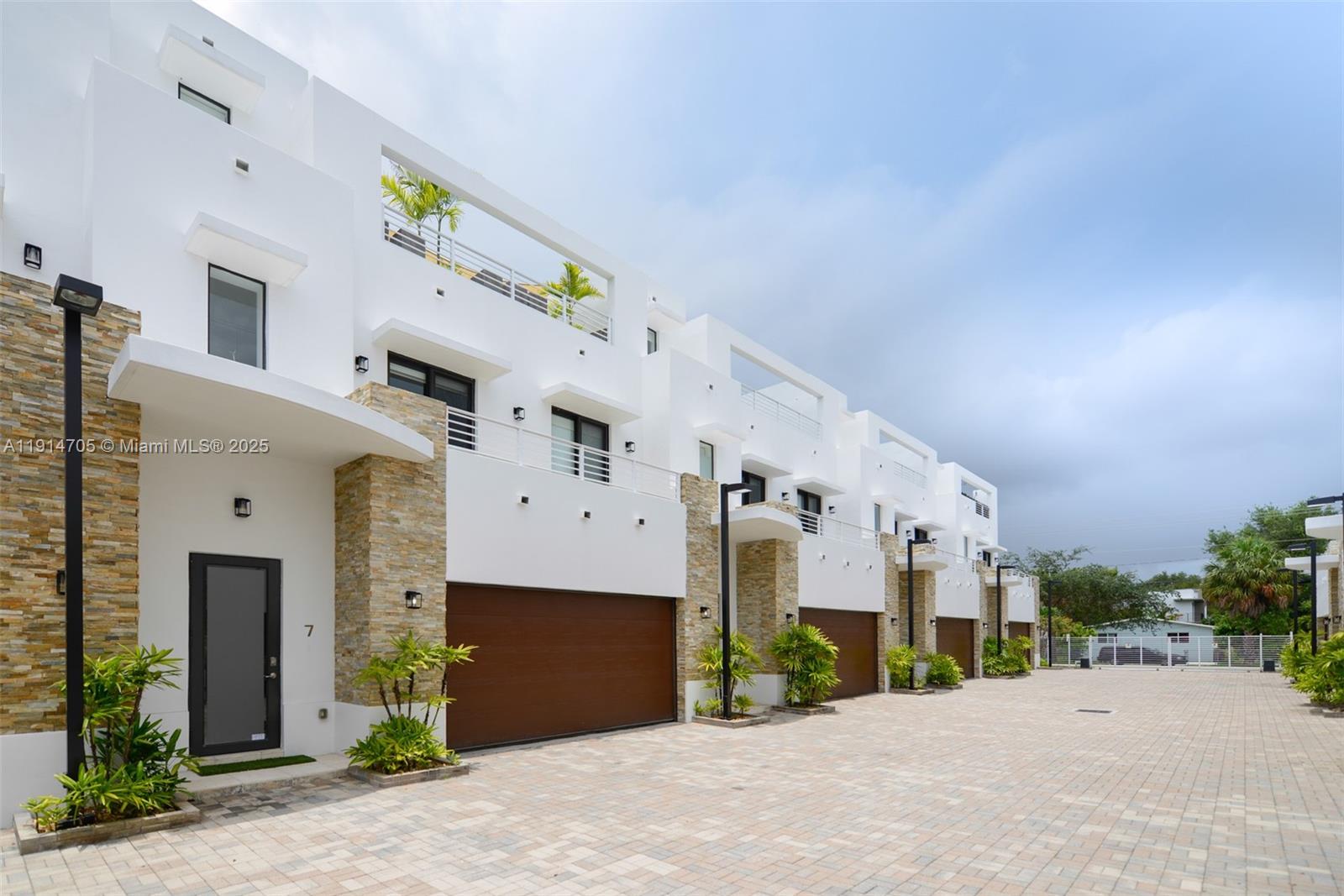 3318 Day Avenue, Unit 7 Miami, FL 33133 - Photo 2 of 39 a front view of a building with a yard