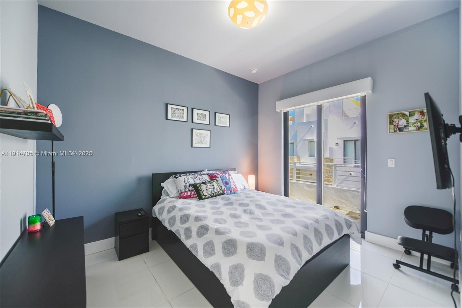 3318 Day Avenue, Unit 7 Miami, FL 33133 - Photo 32 of 39 a bedroom with a bed and dresser