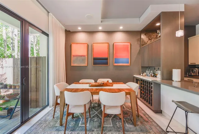 a dining room with furniture and window