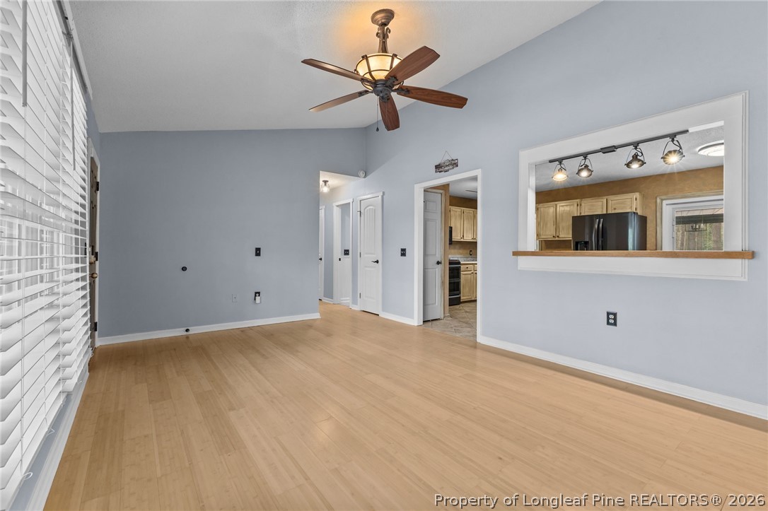 237 Lemuel Black Road Bunnlevel, NC 28323 - Photo 14 of 37 a view of a livingroom with a ceiling fan and window