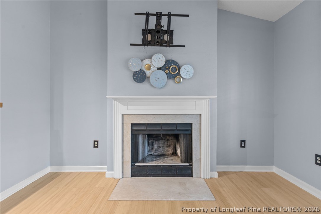 237 Lemuel Black Road Bunnlevel, NC 28323 - Photo 16 of 37 a view of an empty room with a fireplace