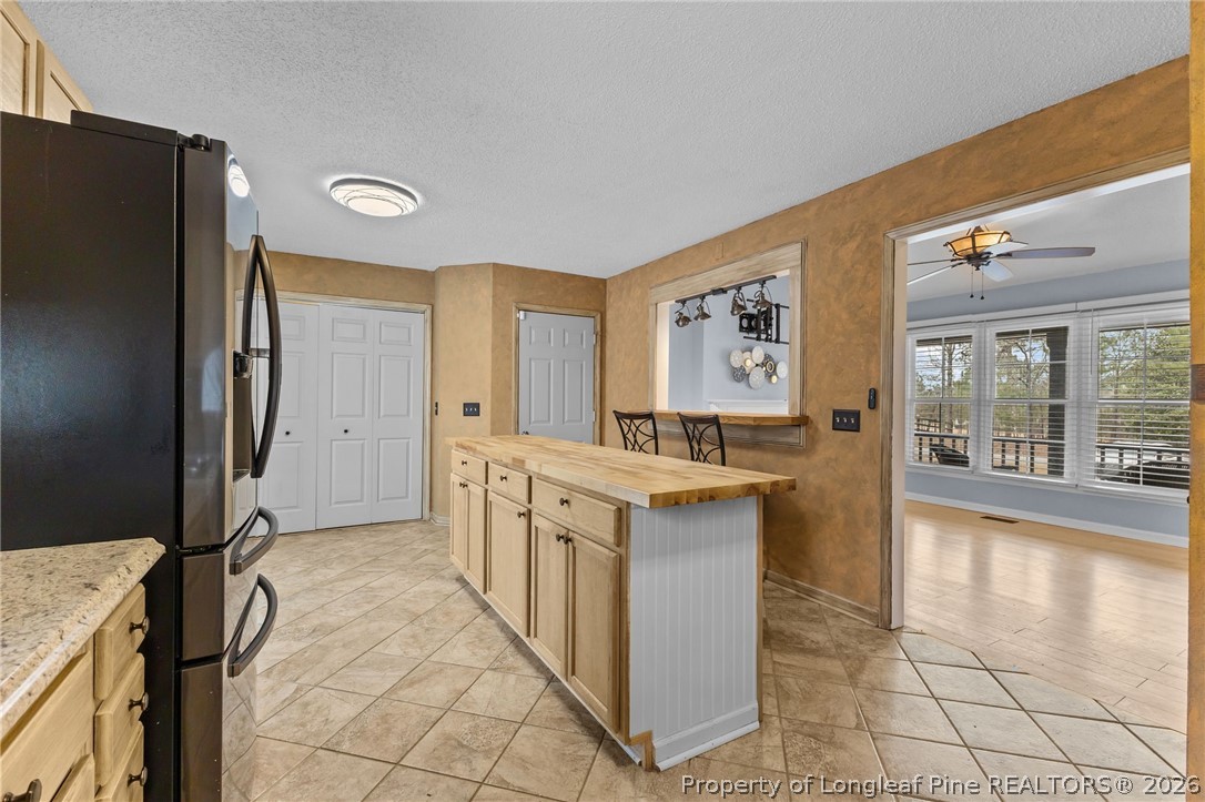 237 Lemuel Black Road Bunnlevel, NC 28323 - Photo 19 of 37 a hall with stainless steel appliances granite countertop a refrigerator and a stove top oven