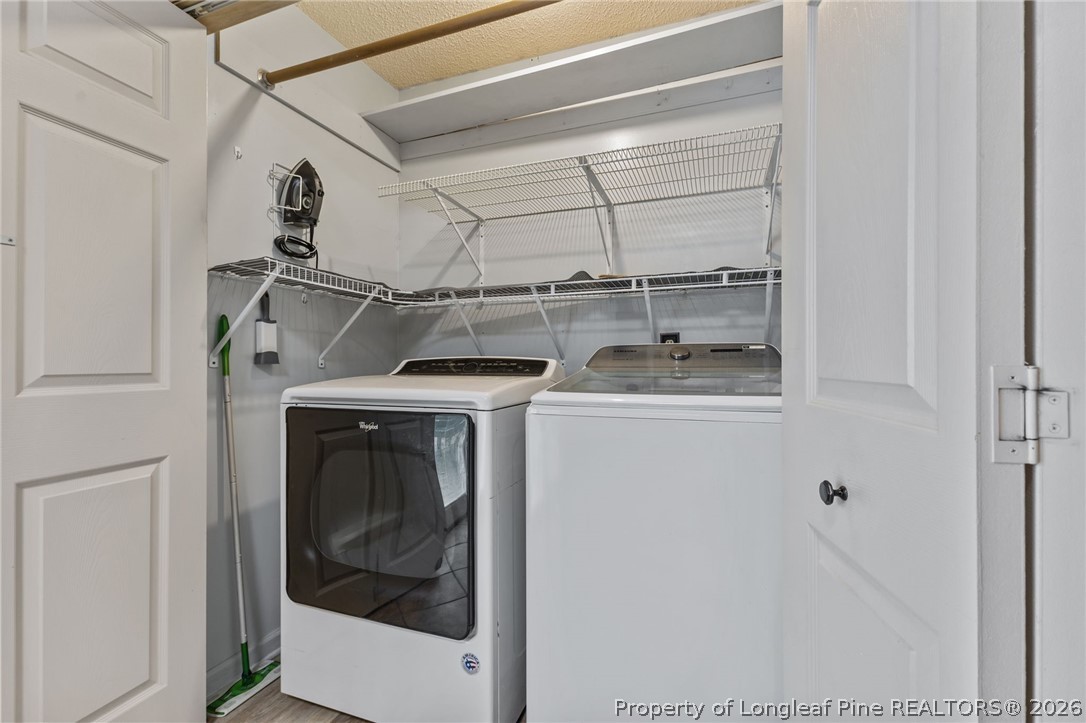 237 Lemuel Black Road Bunnlevel, NC 28323 - Photo 22 of 37 a utility room with dryer and washer