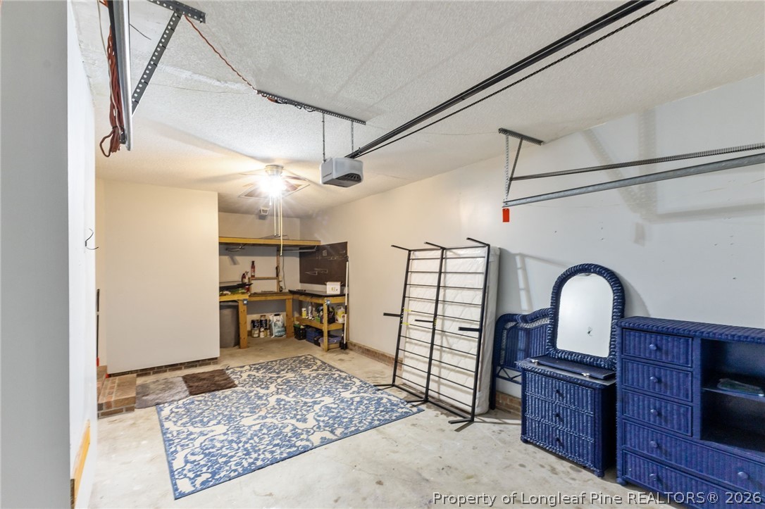 237 Lemuel Black Road Bunnlevel, NC 28323 - Photo 23 of 37 a living room with lots of furniture and a rug