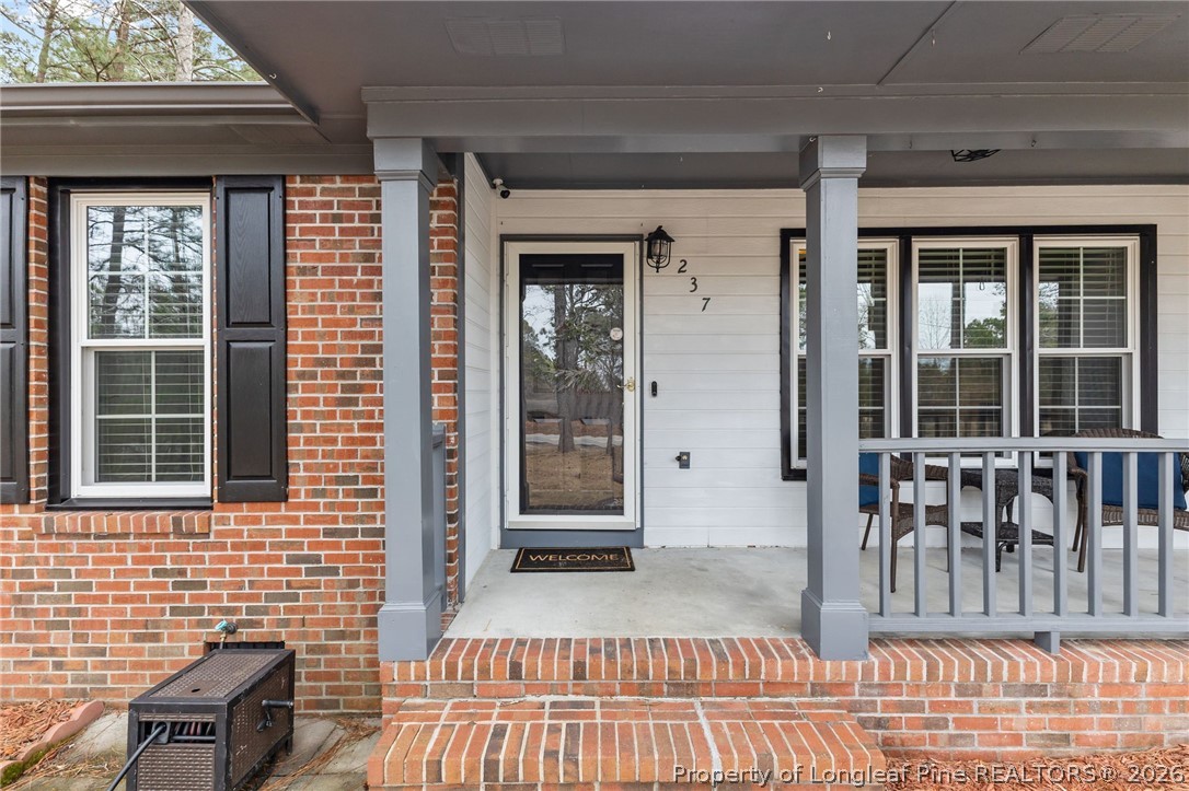 237 Lemuel Black Road Bunnlevel, NC 28323 - Photo 33 of 37 a view of a brick house with large windows