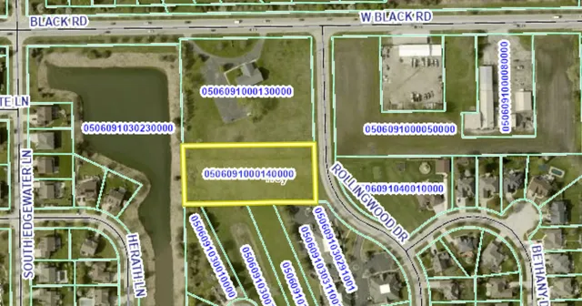 a picture of a floor to ceiling window next to a yard