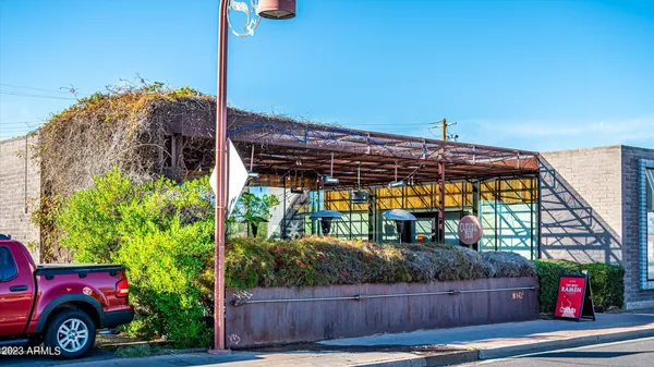 a view of a car park in front of a house