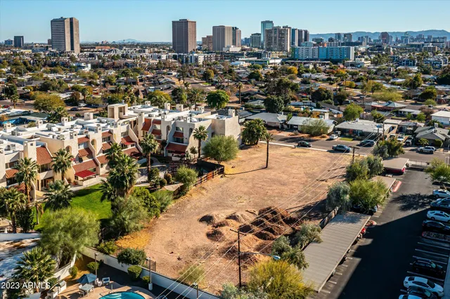 an aerial view of a city with parking