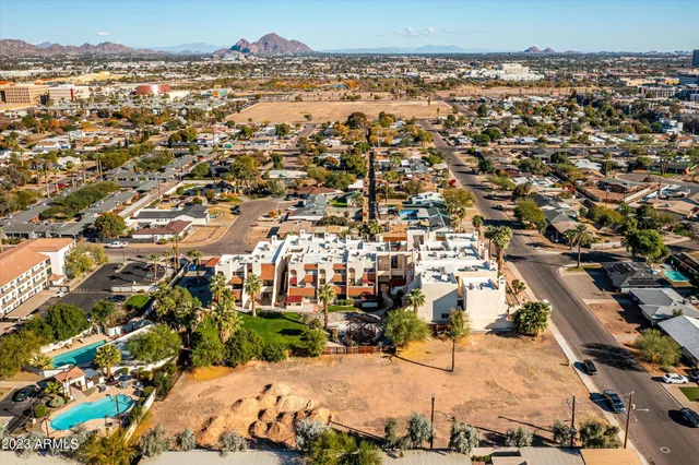 an aerial view of residential houses with outdoor space
