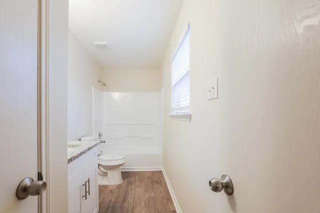 a bathroom with a sink and toilet