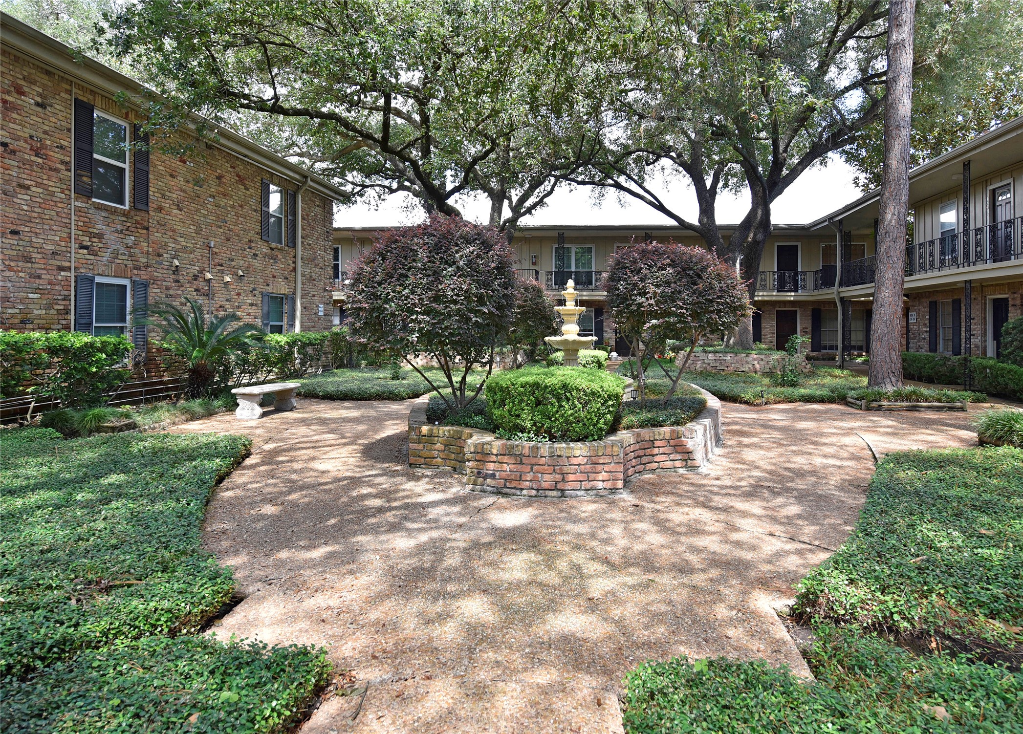 3224 Timmons Lane, Unit 112 Houston, TX 77027 - Photo 3 of 30 a view of road with trees