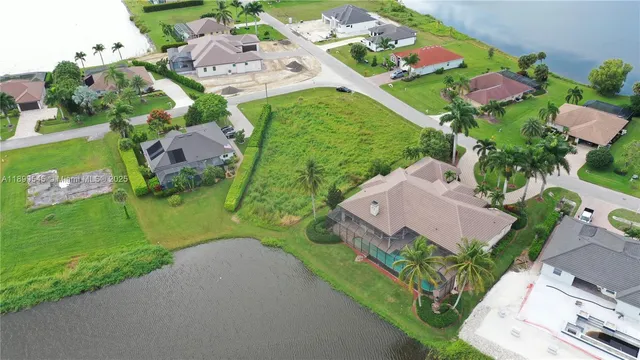 an aerial view of residential house with outdoor space and street view