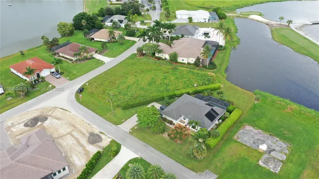 an aerial view of a house with yard