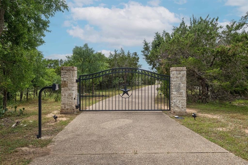 16188 Oak Grove Road Buda, TX 78610 - Photo 1 of 1 a view of a fence