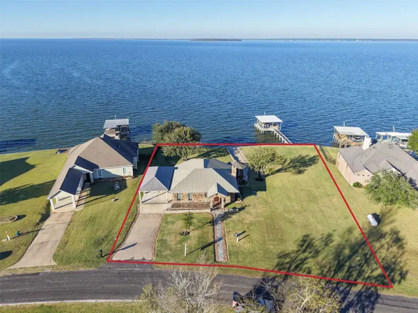 an aerial view of a house with outdoor space