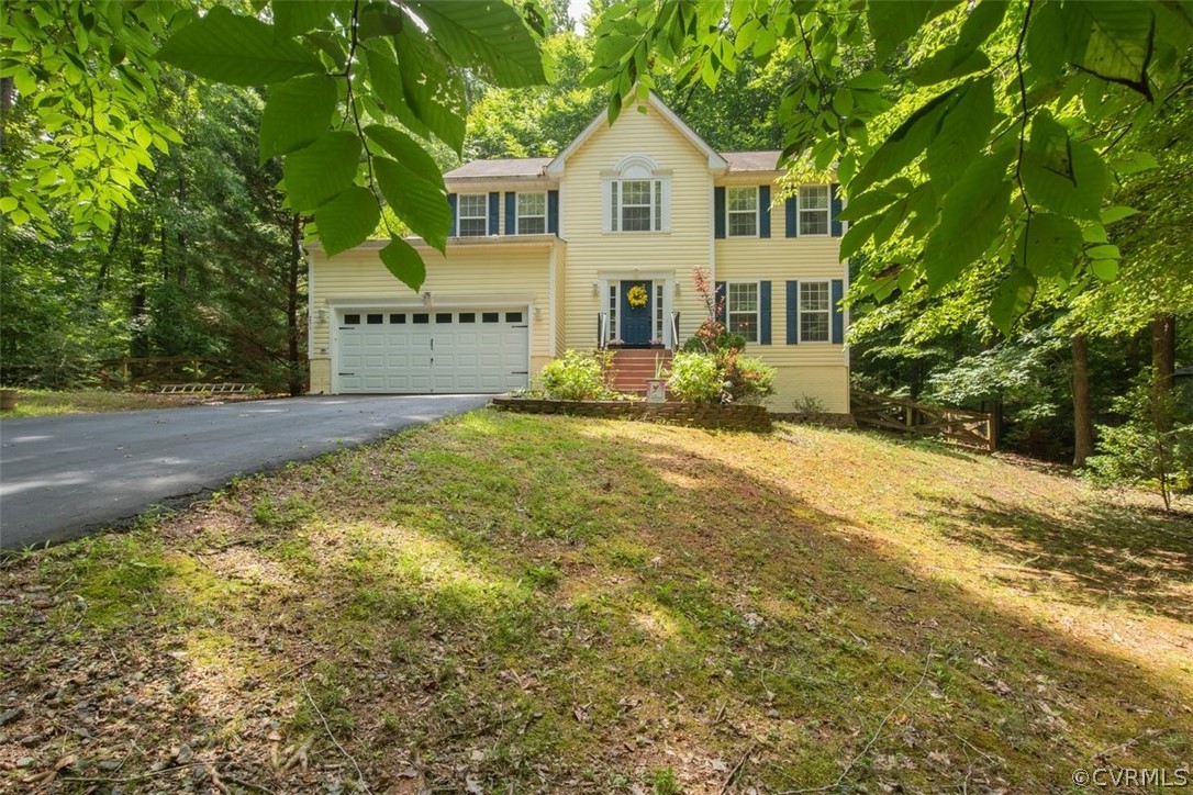 251 Cedar Ridge Drive Ruther Glen, VA 22546 - Photo 6 of 30 a view of a house with a yard