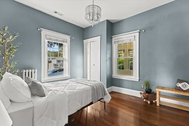 a bedroom with bed and window