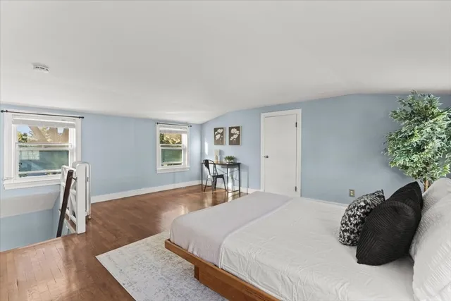 a bedroom with a bed and a couch