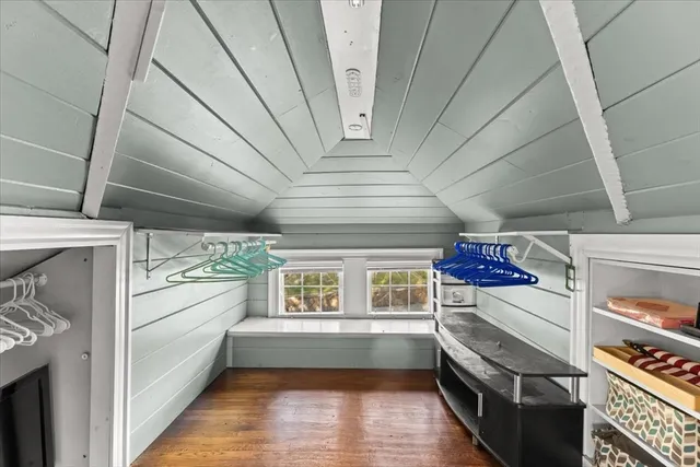 a view of a hallway with a kitchen