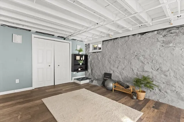 a bedroom with a bed and a table