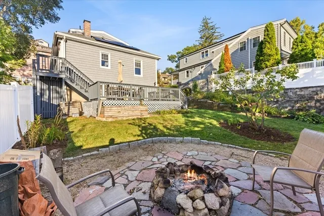a view of a balcony with wooden floor and fence
