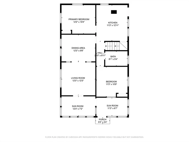 a picture of a bench in front of a wall