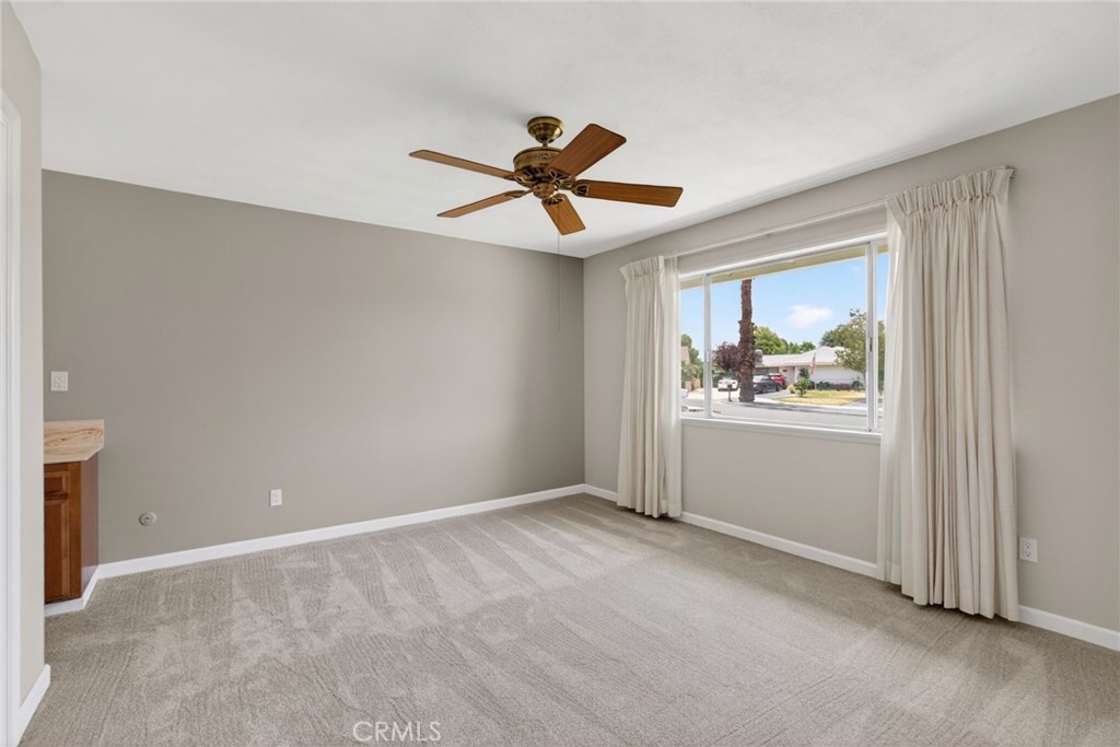 4963 Carlingford Avenue Riverside, CA 92504 - Photo 13 of 33 wooden floor in an empty room with a window