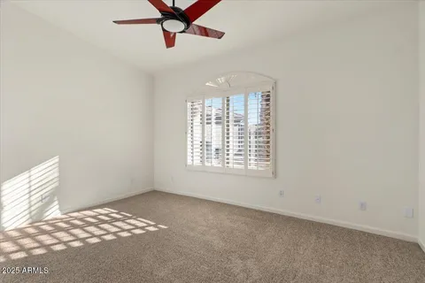 a view of an empty room with a fireplace