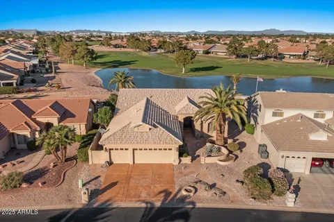 an aerial view of a house with a ocean view