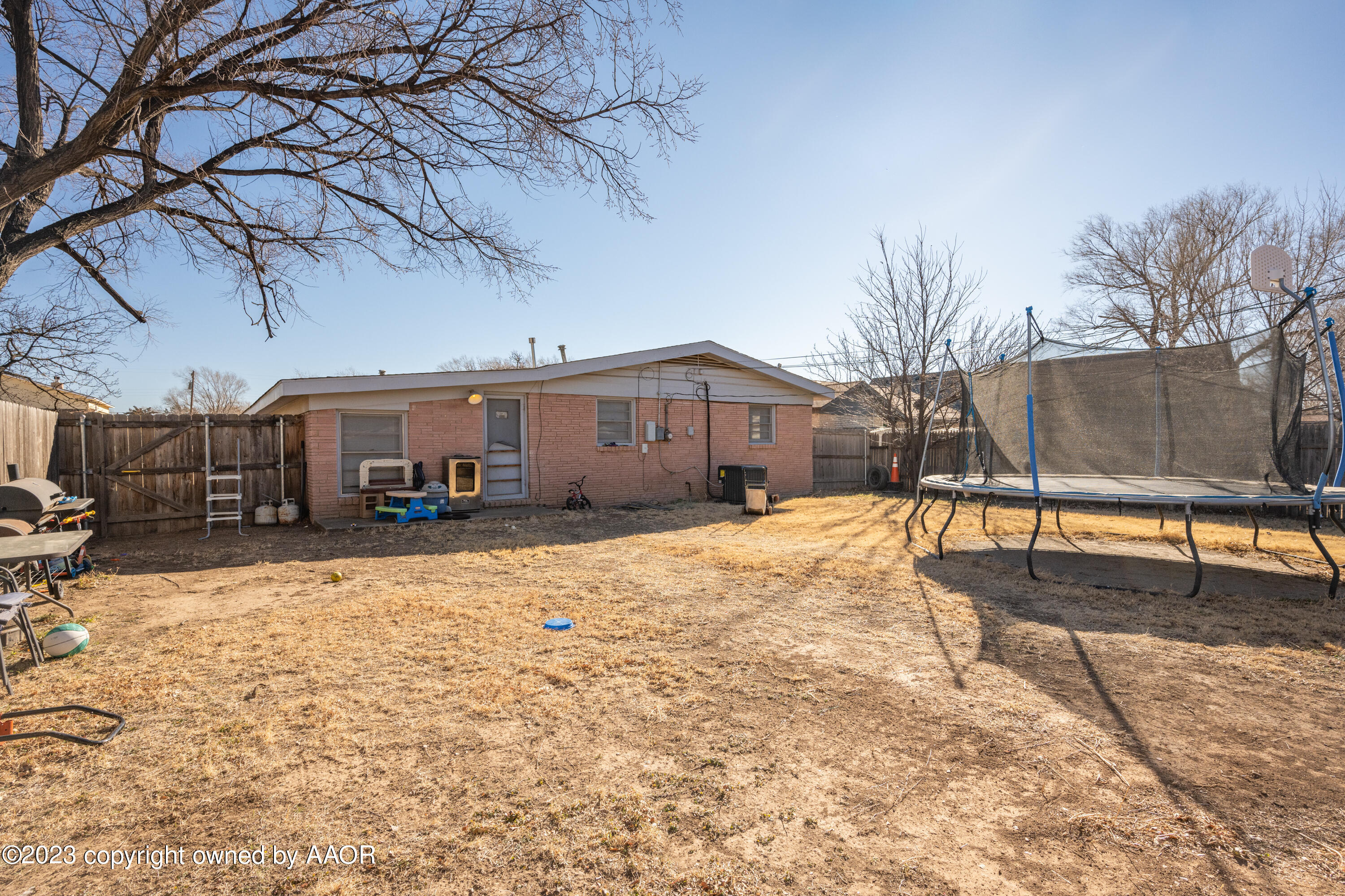 4106 Crockett Street Amarillo, TX 79110 - Photo 23 of 24 a front view of a house with a yard