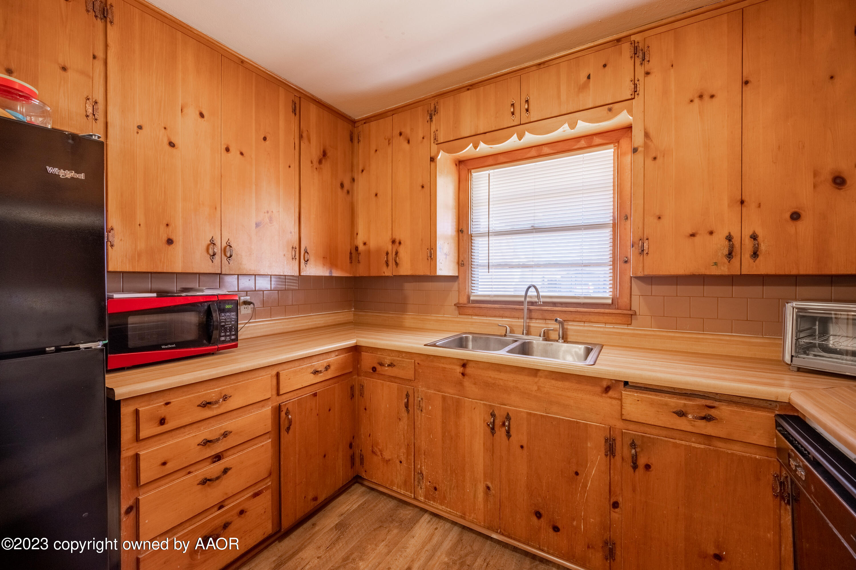 4106 Crockett Street Amarillo, TX 79110 - Photo 8 of 24 a kitchen with stainless steel appliances a sink stove and cabinets