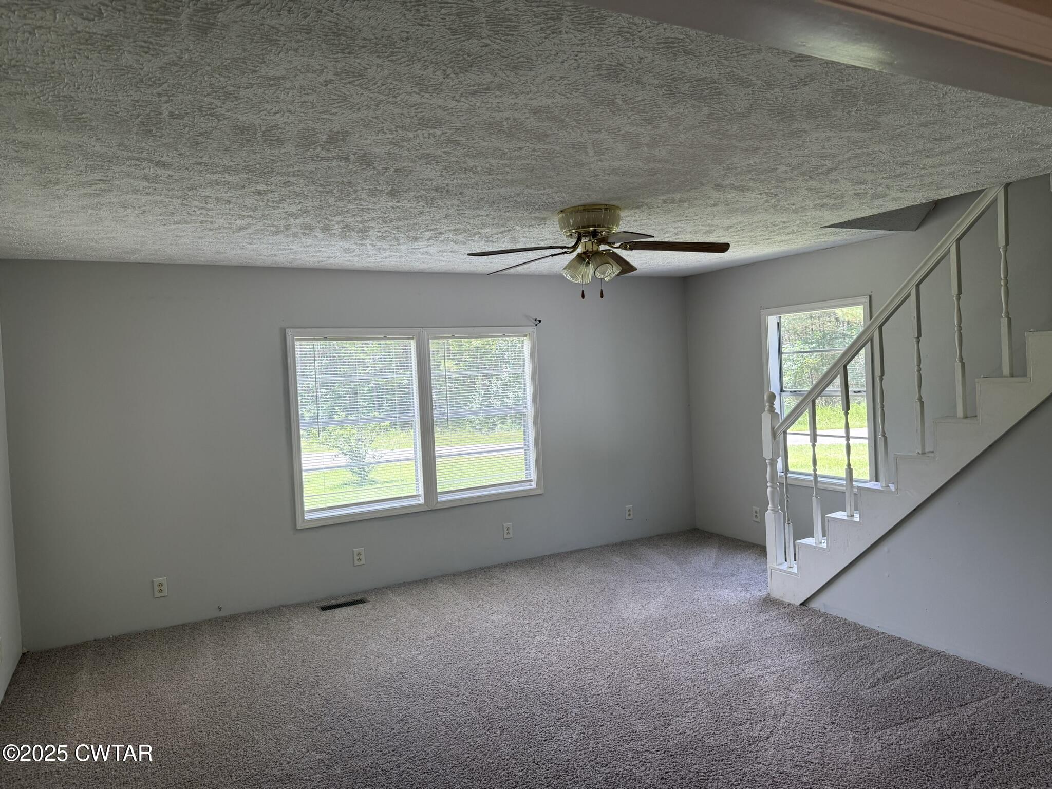325 Jennings Road Reagan, TN 38368 - Photo 2 of 10 an empty room with a empty space and windows
