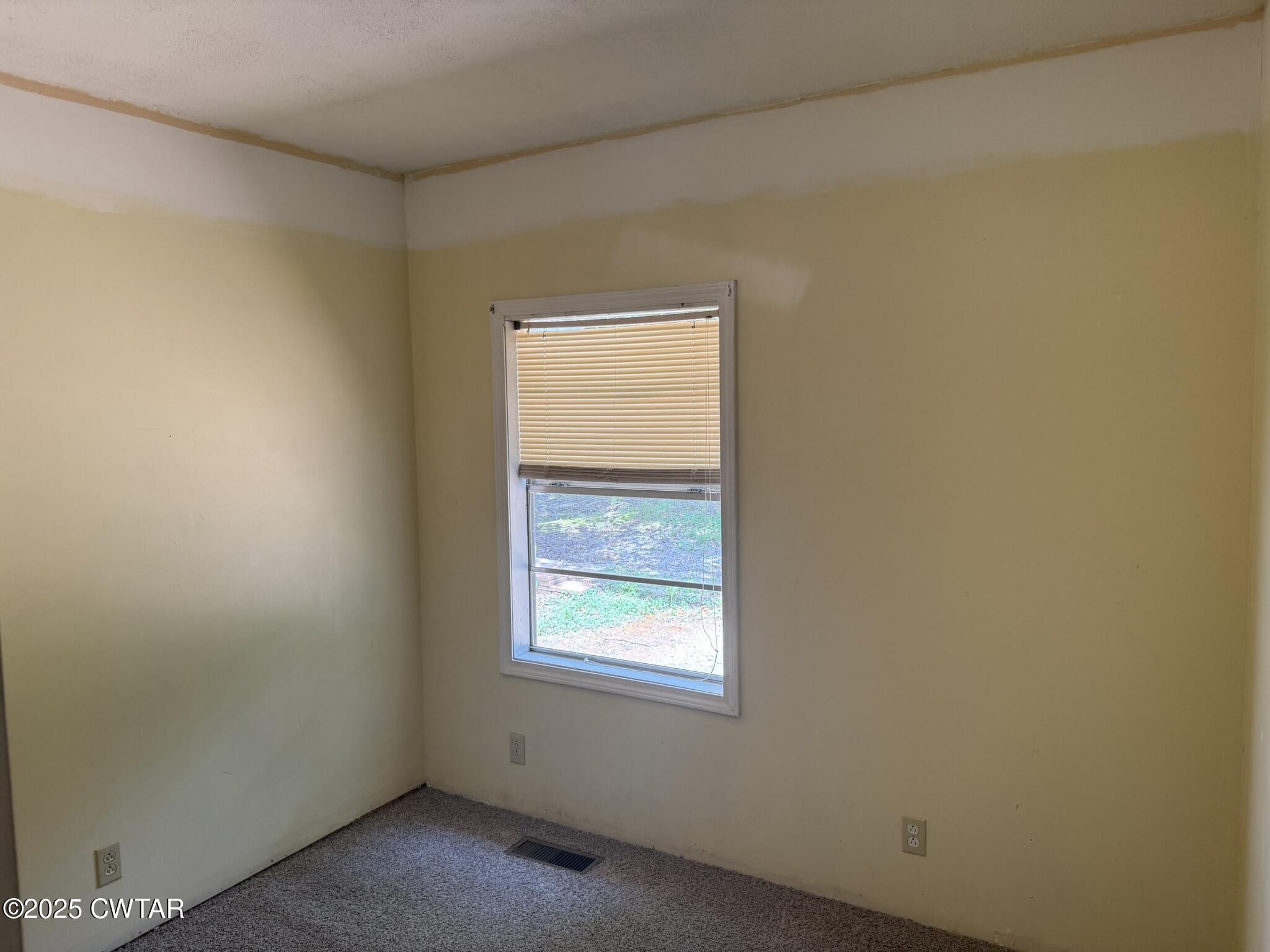 325 Jennings Road Reagan, TN 38368 - Photo 4 of 10 an empty room with windows