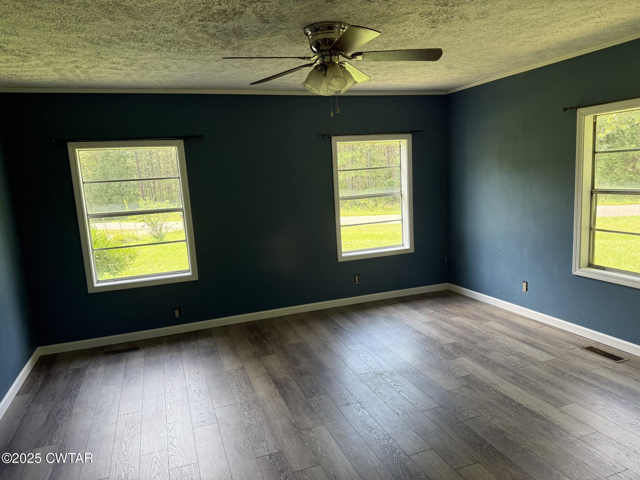 325 Jennings Road Reagan, TN 38368 - Photo 7 of 10 a view of an empty room with window and wooden floor