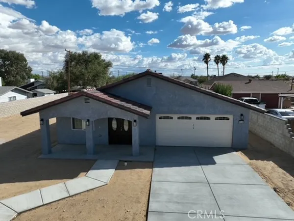 a view of a backyard of a house