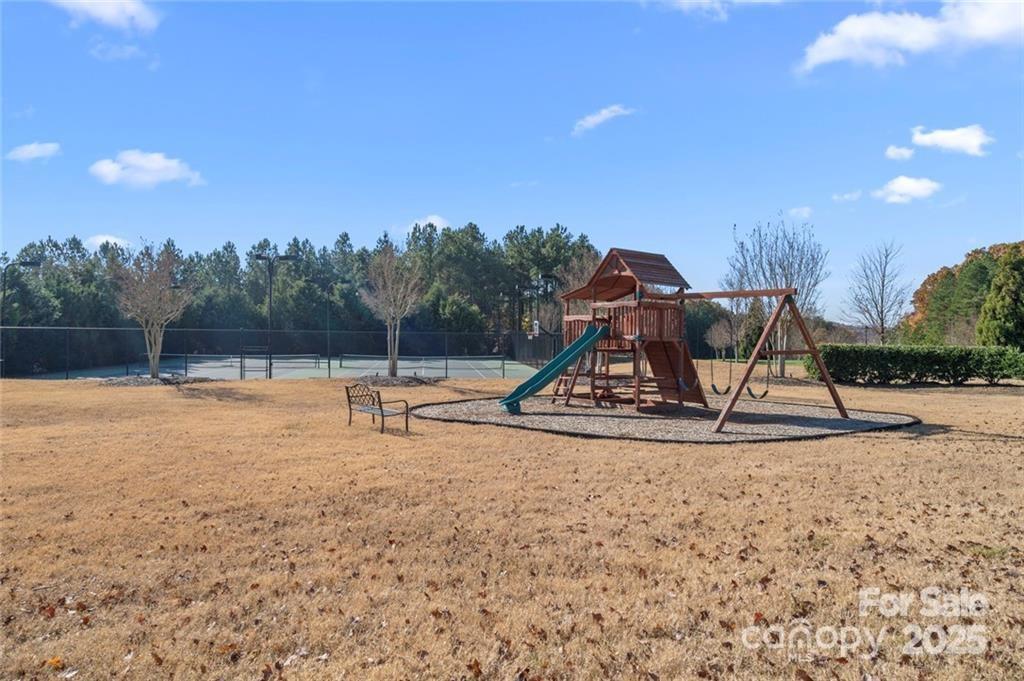 1029 Glade Spring Court Belmont, NC 28012 - Photo 23 of 31 a view of a park with swings and slides