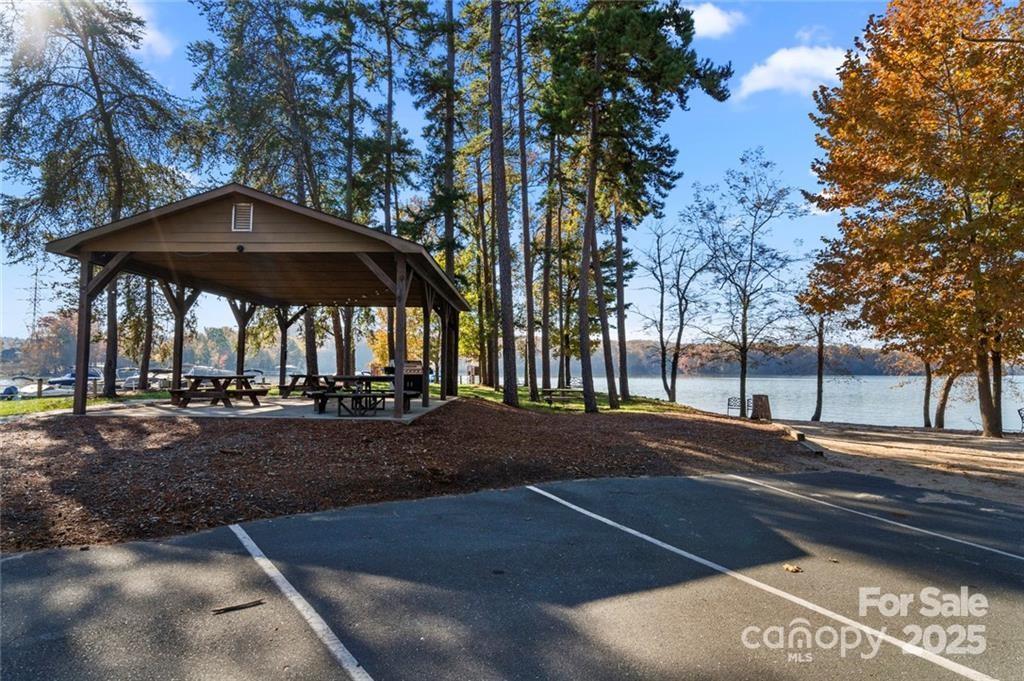 1029 Glade Spring Court Belmont, NC 28012 - Photo 29 of 31 a view of a street with a bench and trees