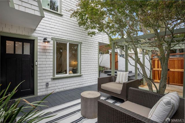 a view of a porch with furniture