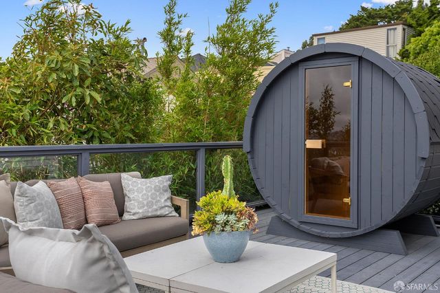 a kitchen with granite countertop white cabinets and a stove