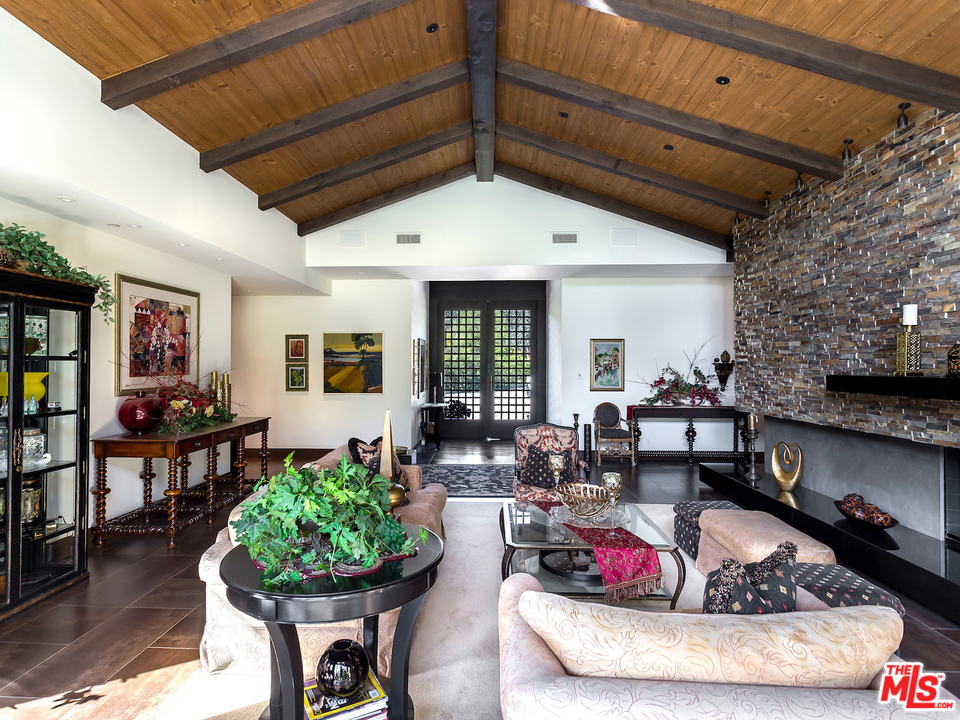 24754 Robert Guy Road Hidden Hills, CA 91302 - Photo 11 of 18 a living room with furniture and a potted plant
